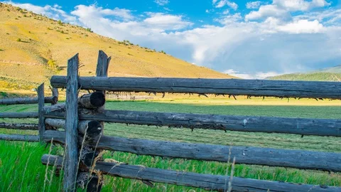 Old West Cattle Ranch Farm field Slider along a log fence Time Lapse 4K Stock Footage 129354027
