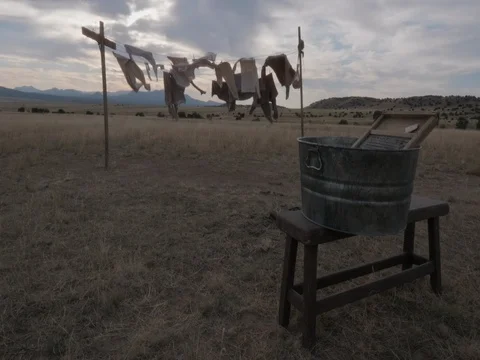 Old Western Clothes on a Clothes Line With Washbaord in Foreground Stock Footage 84156930
