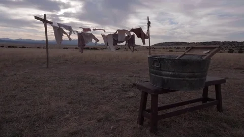 Old Western Clothes on a Clothes Line With Washbaord in Foreground in Slow Mo Stock Footage 84156963