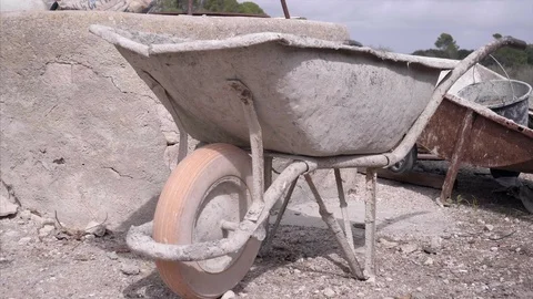 Old wheel barrow Stock Footage 98571328