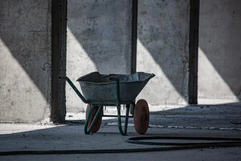 Old wheelbarrow in construction empty space site Stock Photos