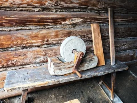 Old whetstone which was still manually operated with crank. Fotos Stock