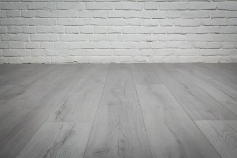 Old white brick wall and wood floor background Stock Photos