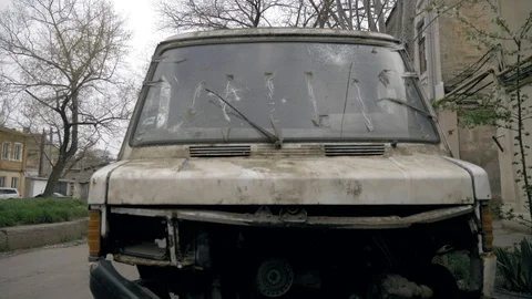 Old white broken broken bus, vandals, hooligans, graffiti, abandoned car. Stock Footage 107113165