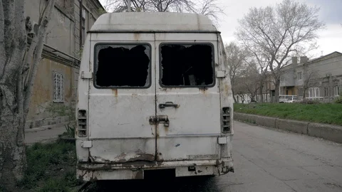 Old white broken broken bus, vandals, hooligans, graffiti, abandoned car. Stock Footage 107113825