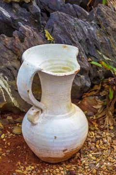 Old white broken pitcher Stock Photos