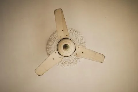 Old White Ceiling Fan with Plain White Blades Stock Photos