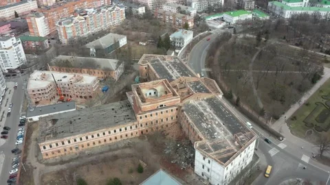 Old white dilapidated building with columns in the city Stock Footage 158855225