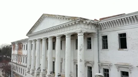 Old white dilapidated building with columns in the city Stock Footage 158855248