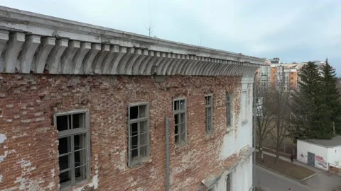 Old white dilapidated building with columns in the city Stock Footage 158855250