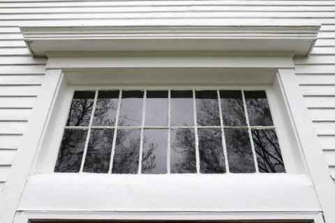 Old White Exterior Window Frame with Grille Pains on Historic Little Church Stock Photos
