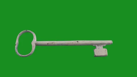 Old white key moves on green screen Stock Footage 265481219