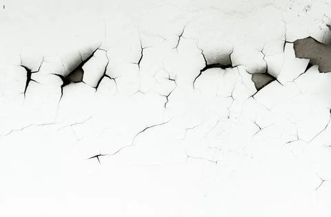 Old white paint on wall. Surface texture with cracked peeling paint. Stock Photos