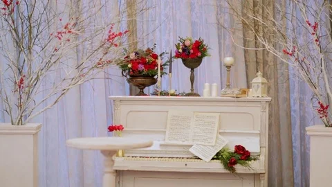 The old white piano with notes and flowers Video stock 73348210