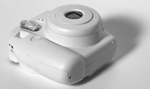 Old white plastic camera on a white background. Stock Photos