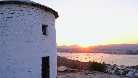 Old, white, stone windmill and cityscape with Aegean Sea in Bodrum, Turkey. Stock Footage 144433693