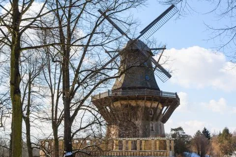 Old wind mill at the winter forest landscape Stock Photos