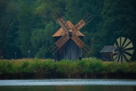 Old Windmill Against a Forest Background Stock Photos