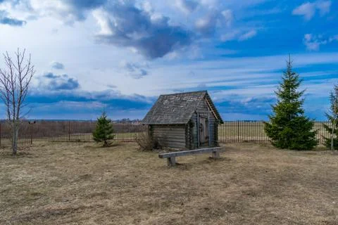 Old windmill and flour storage house from rain and moisture Stock Photos