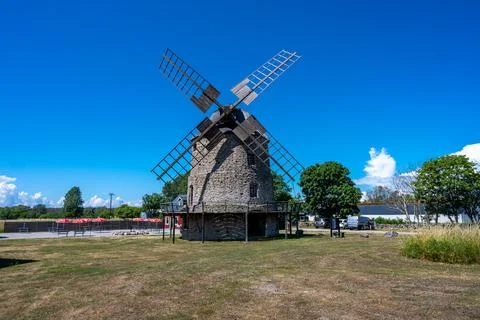 An old windmill with a blue sky background Stock Photos