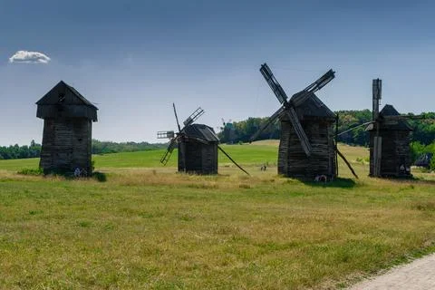 Old windmill on blue sky background Stock Photos