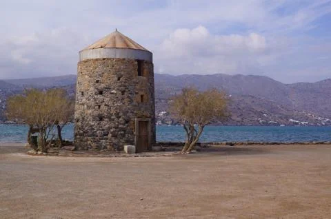 An old windmill built in stone in Elounda, Eastern Crete (Greece) Stock Photos