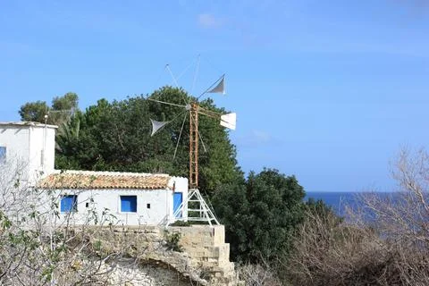 Old windmill in Cyprus by the baths of Aphrodite Stock Photos