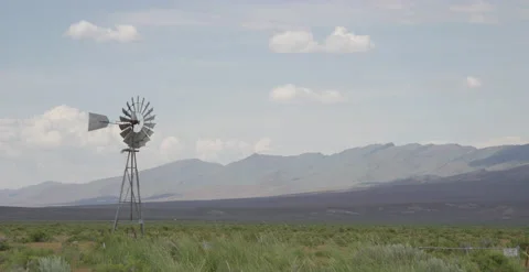 Old Windmill in Desert with Mountains Behind and Clouds - 6K Slow motion 스톡 동영상 144070514