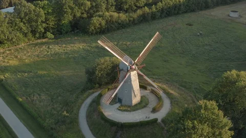 Old Windmill next to small road in the field with trees beautiful sunset Stock Footage 123020889