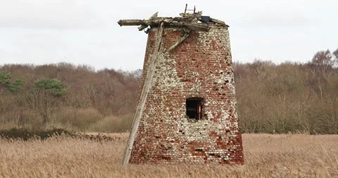 An old windmill in a reed bed at Walberswick on the Suffolk coast, UK. Stock Footage 337592280