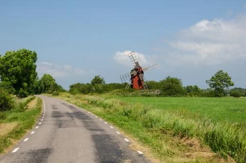 Old windmill by roadside Stock Photos