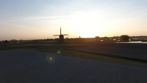 Old windmill shot in the morning with beautiful sunrise and nice bokeh effect an Stock Footage