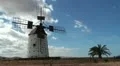 Old windmill in a spanish countryside with blue sky - timelapse HD Footage