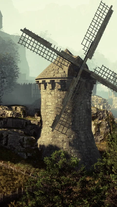 Old windmill stands on hill near town with distant mountains in background Stock Footage 337972664