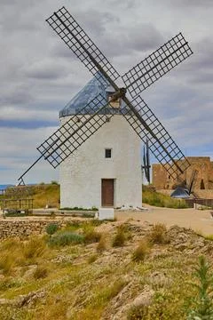 Old windmill in top of the hill in Consuegra Village Stock Photos