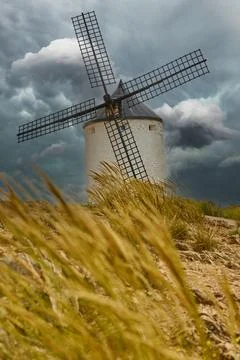 Old windmill in top of the hill in Consuegra Village Stock Photos