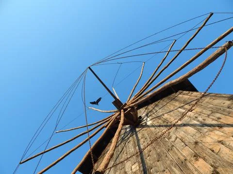 Old windmill towards the clear blue sky Stock Photos