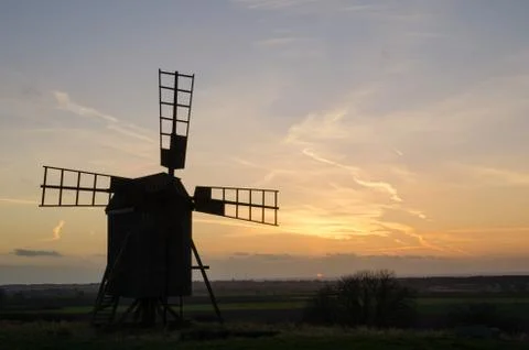 Old windmill at twilight Stock Photos