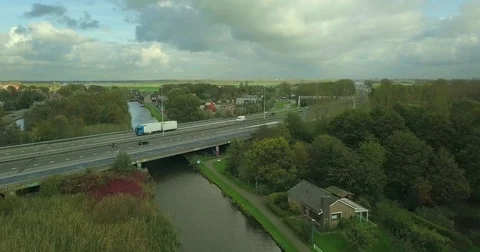 Old windmill in typical Dutch landscape with highway in the background Stock Footage 81534808