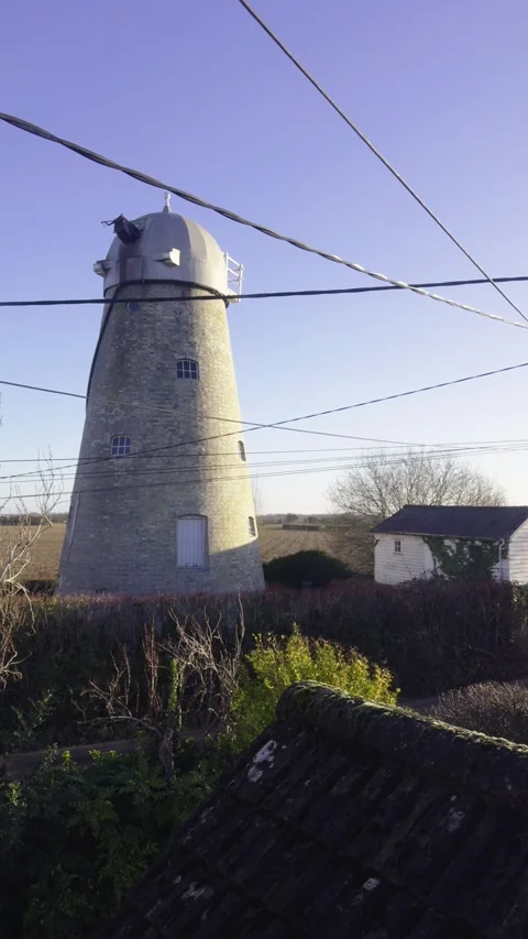 Old Windmill in the UK Countryside Vertical Format Stock Footage 327323143