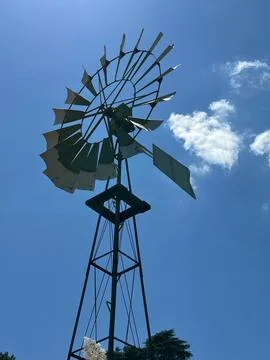 Old windmill under clear blue sky Stock Photos