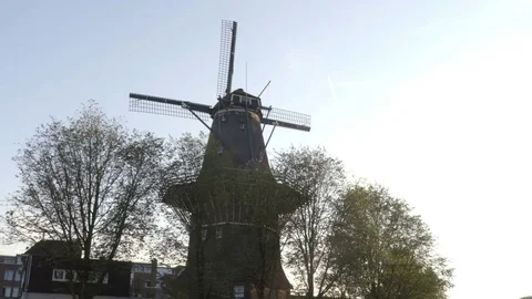 Old windmill view from the amsterdam canal Stock Footage 83631016