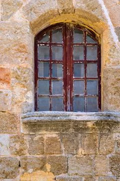 Old window on an ancient wall Stock Photos