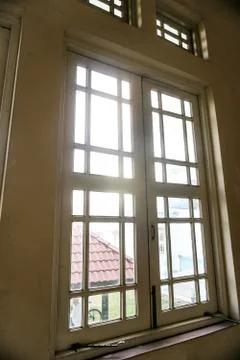 Old window and broken windows with a view looking outside. - Image Stock Photos