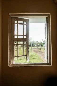 Old window and broken windows with a view looking outside. - Image Stock Photos