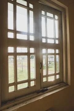 Old window and broken windows with a view looking outside. - Image Stock Photos