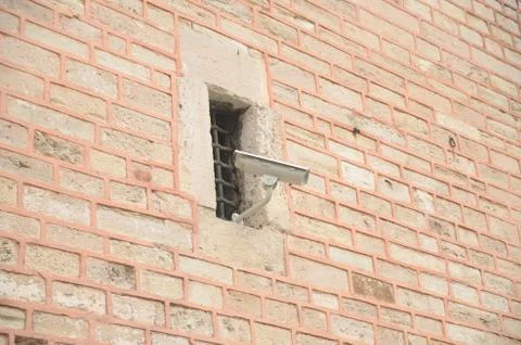 Old Window and Security Camera Stock Photos
