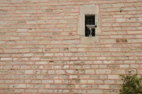 Old Window and Security Camera Stock Photos