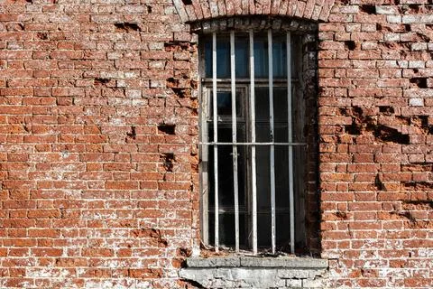 Old window with bars. Stock Photos