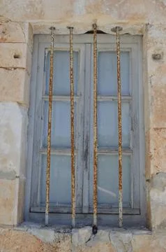 Old window behind bars Stock Photos